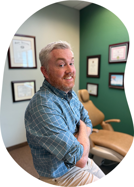 Dr Tennison In His Office Smiling At The Camera