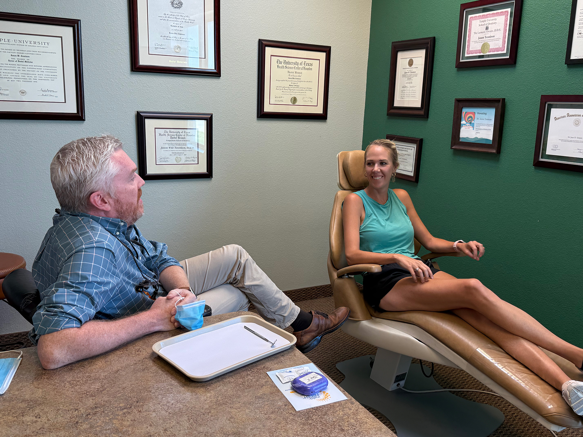 Dr Tennison In Office With Patient