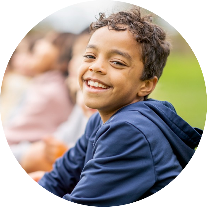 Child smiling in circular image