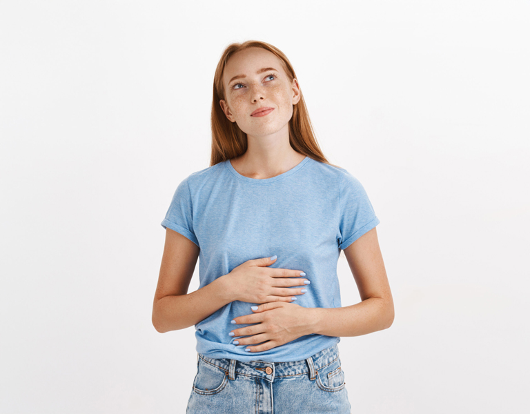 Contemplative Young Woman With Her Hands On Her Stomach Scaled