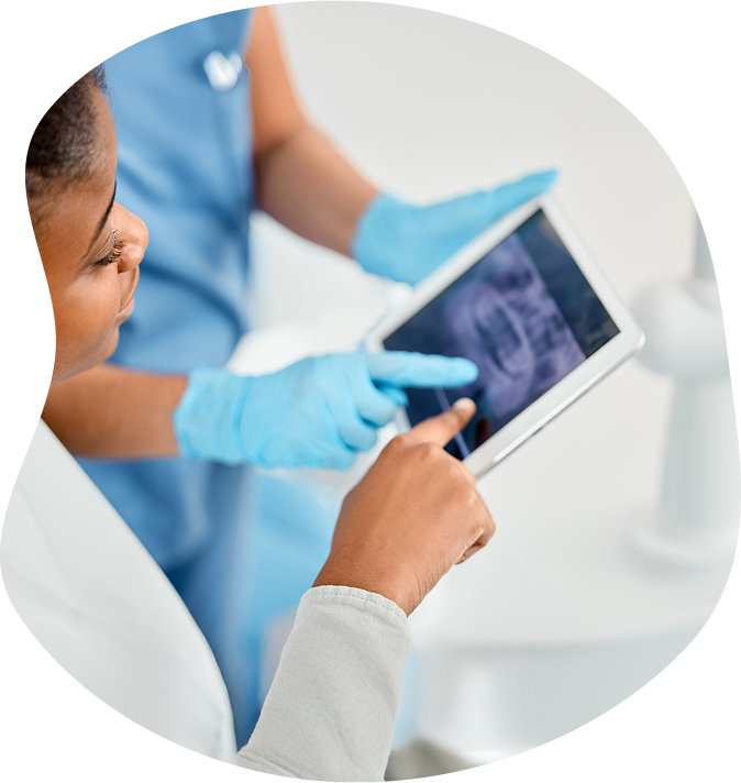 Doctor And Technician Examining Teeth Xray