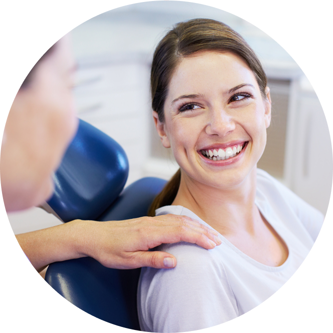 Woman In Office Smiling Up At Orthodontist