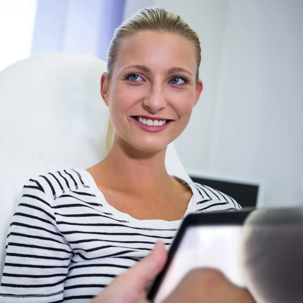 Woman getting an consult from an orthodontist.
